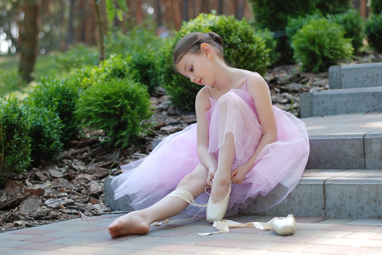 putting ballet shoes on